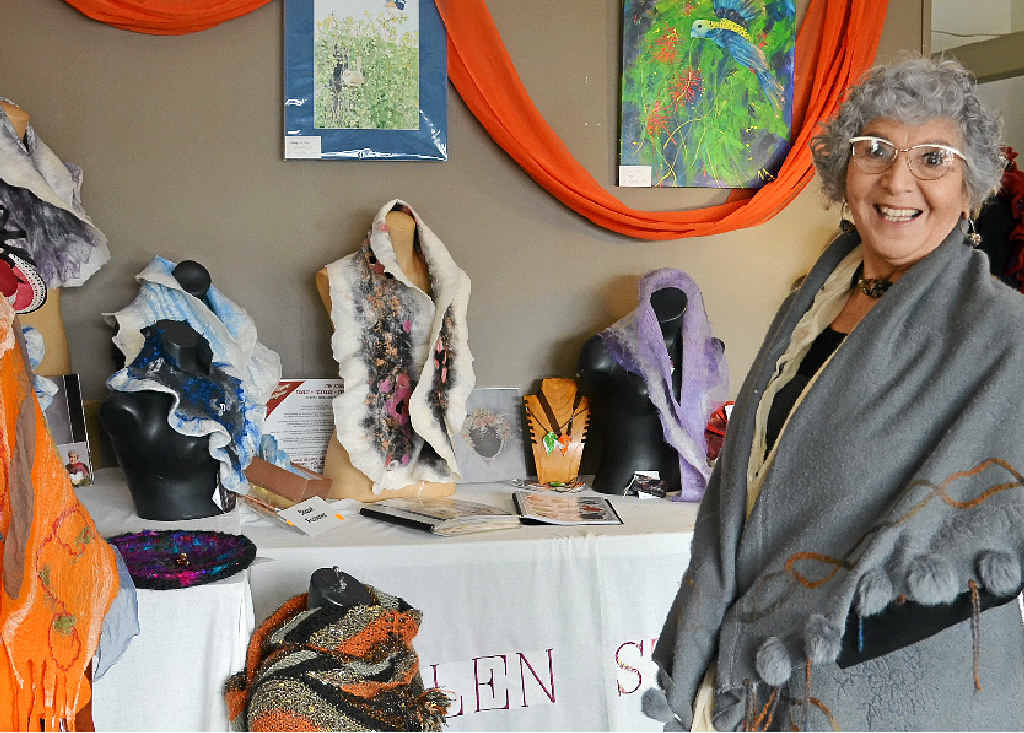 Helen Stumkat proudly admires some of her work.